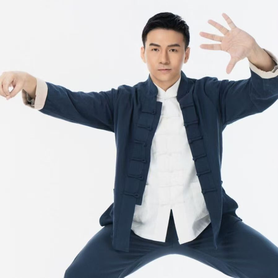 The supplied white-background portrait of Teacher Yang practising Tai Chi.